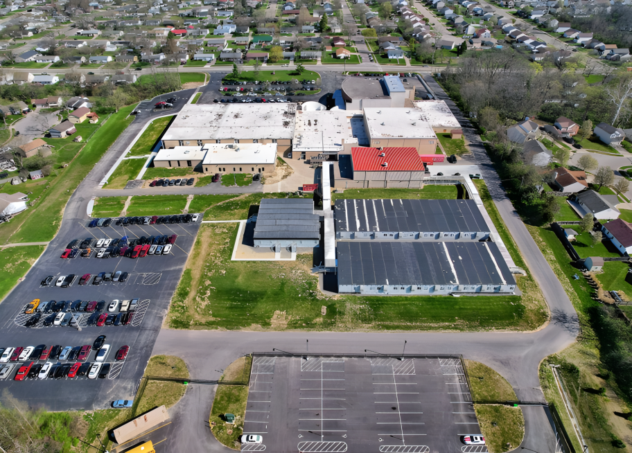 aerial view of buildings and parking lot